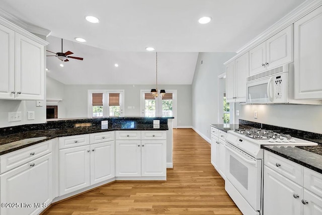 600 Sea Castle Ct, Wilmington, NC 28412 - kitchen featuring light wood-type flooring, vaulted ceiling, a ceiling fan, and white appliances