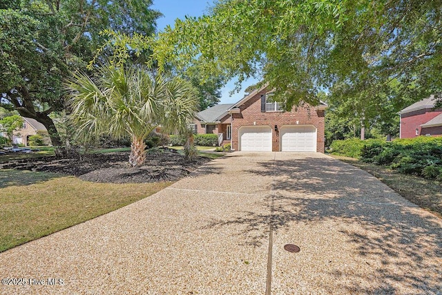 600 Sea Castle Ct, Wilmington, NC 28412 - view of front of home featuring driveway, brick siding, and a garage