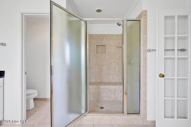 600 Sea Castle Ct, Wilmington, NC 28412 - bathroom featuring a shower stall, tile patterned floors, and toilet