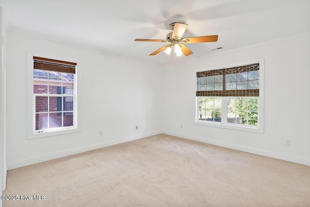 600 Sea Castle Ct, Wilmington, NC 28412 - empty room with light colored carpet, ornamental molding, baseboards, and a healthy amount of sunlight
