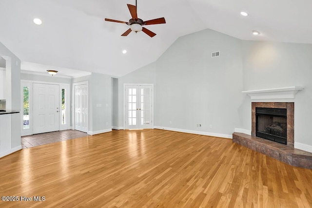 600 Sea Castle Ct, Wilmington, NC 28412 - unfurnished living room featuring a fireplace, light wood finished floors, a ceiling fan, and visible vents