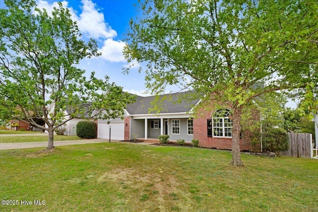 single story home with driveway, an attached garage, fence, brick siding, and a front lawn