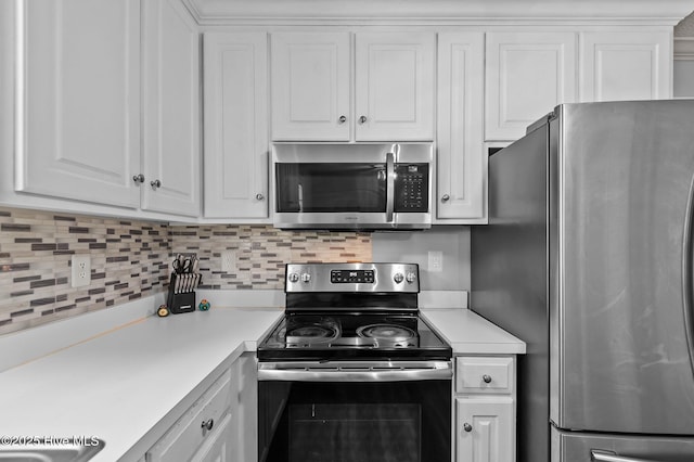 5065 Chris Rd, Bailey, NC 27807 - kitchen featuring light countertops, appliances with stainless steel finishes, white cabinets, and decorative backsplash