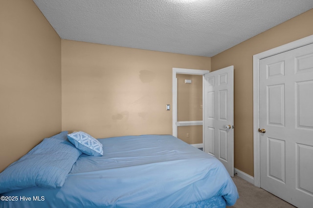5065 Chris Rd, Bailey, NC 27807 - bedroom with baseboards, carpet flooring, and a textured ceiling
