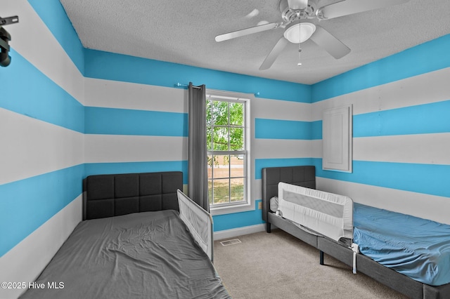 5065 Chris Rd, Bailey, NC 27807 - bedroom featuring a textured ceiling, visible vents, ceiling fan, and carpet