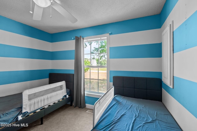 5065 Chris Rd, Bailey, NC 27807 - bedroom featuring visible vents, a textured ceiling, carpet, and a ceiling fan