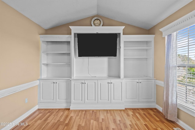 5065 Chris Rd, Bailey, NC 27807 - unfurnished living room featuring baseboards, lofted ceiling, and light wood-style floors