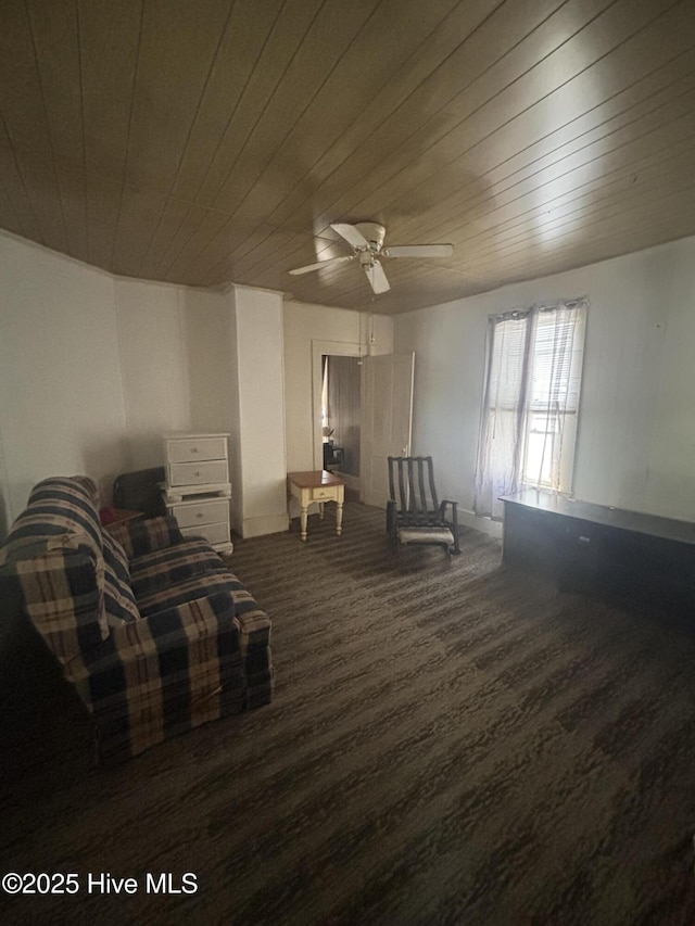 living area featuring wood ceiling, ceiling fan, and wood finished floors
