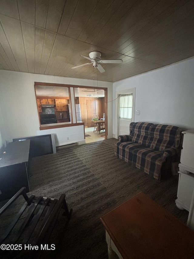 living room featuring wooden ceiling and a ceiling fan