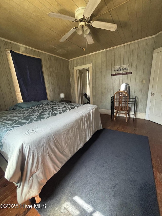 bedroom with wood walls, wooden ceiling, and wood finished floors