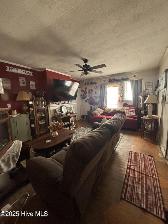 living room with ceiling fan and wood finished floors