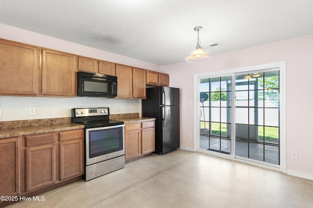 kitchen with baseboards, brown cabinets, black appliances, and dark countertops