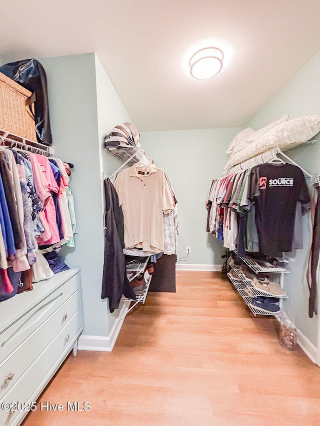 walk in closet featuring light wood-type flooring