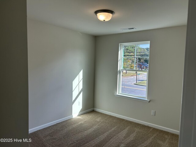 586 Chicod St, Grimesland, NC 27837 - carpeted spare room featuring baseboards and visible vents