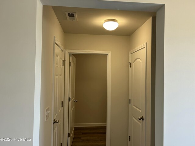 586 Chicod St, Grimesland, NC 27837 - corridor with visible vents, baseboards, and dark wood-style floors