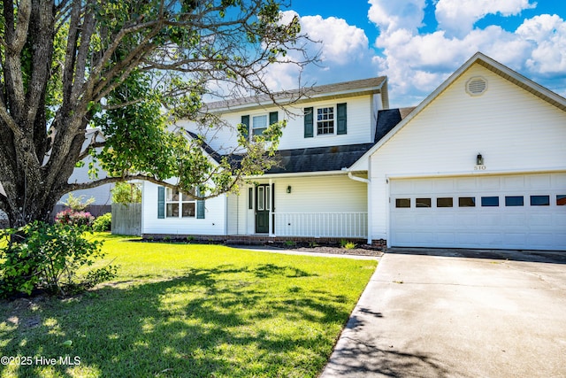 traditional-style house with a garage, covered porch, a front yard, a shingled roof, and concrete driveway