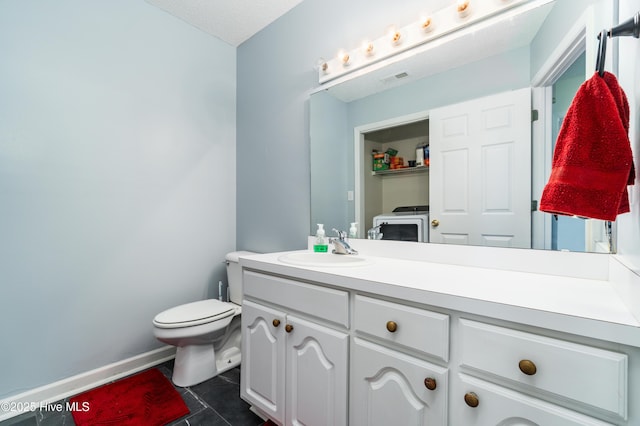 half bathroom featuring tile patterned flooring, visible vents, vanity, toilet, and baseboards