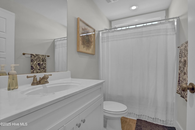 bathroom with vanity, toilet, and a shower with shower curtain