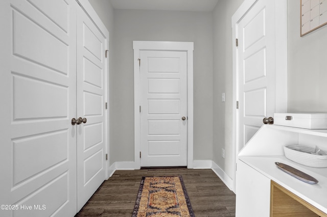 mudroom with baseboards and dark wood finished floors