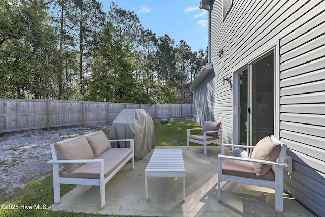 view of patio / terrace with an outdoor hangout area, a fenced backyard, and grilling area