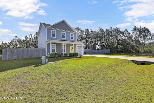 traditional-style house featuring a garage, fence, concrete driveway, a front yard, and a porch