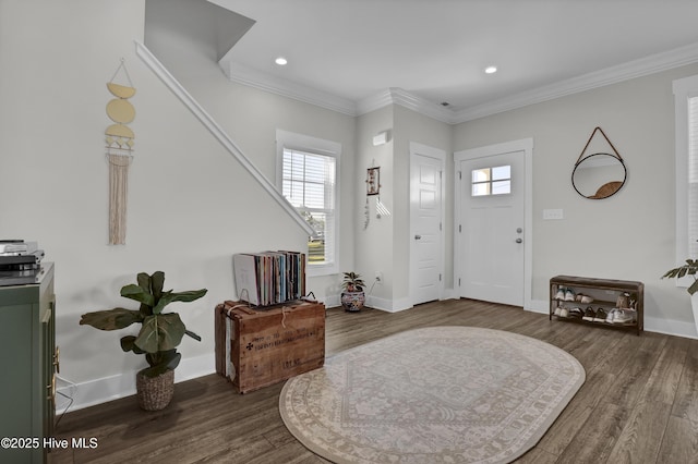 entryway featuring wood finished floors, baseboards, and a healthy amount of sunlight