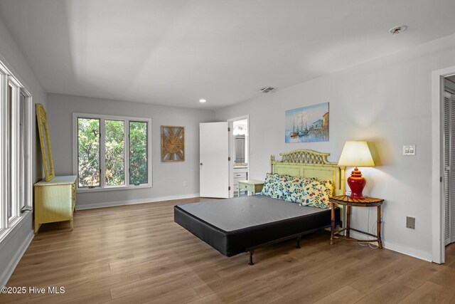 289 Salter Path Rd Unit 32, Pine Knoll Shores, NC 28512 - bedroom with recessed lighting, baseboards, visible vents, and wood finished floors