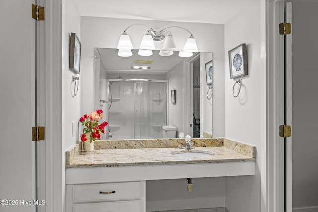 bathroom with vanity and a stall shower