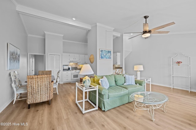 living room featuring high vaulted ceiling, ceiling fan, baseboards, and ornamental molding