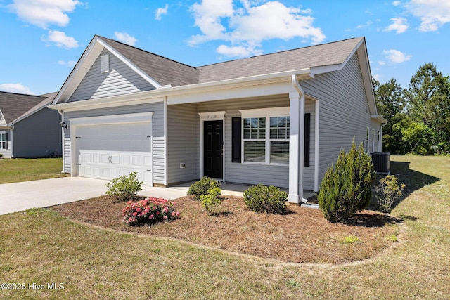 310 Settlers Pointe Dr, Pikeville, NC 27863 - ranch-style house with a garage, concrete driveway, a front yard, a porch, and central air condition unit