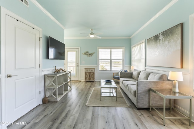 615 N New River Dr Unit E, Surf City, NC 28445 - living area with visible vents, a ceiling fan, crown molding, and wood finished floors