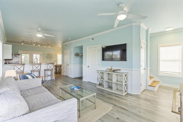 615 N New River Dr Unit E, Surf City, NC 28445 - living room featuring a ceiling fan, light wood-style flooring, rail lighting, and ornamental molding