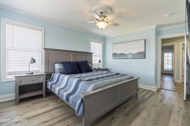615 N New River Dr Unit E, Surf City, NC 28445 - bedroom with ceiling fan, ornamental molding, baseboards, and light wood-style floors