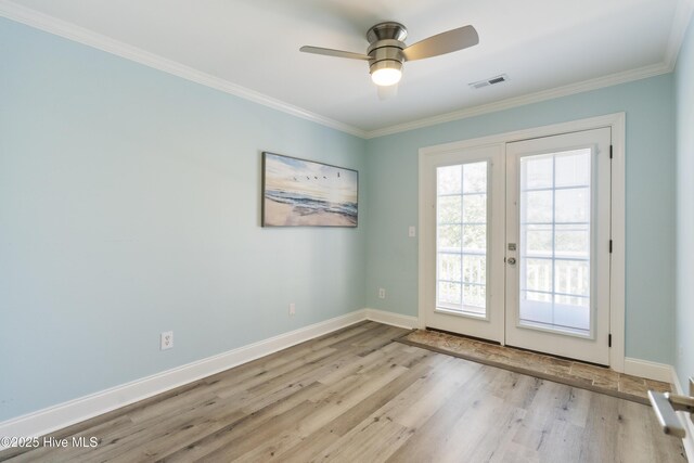 615 N New River Dr Unit E, Surf City, NC 28445 - doorway to outside featuring crown molding, french doors, a ceiling fan, wood finished floors, and visible vents
