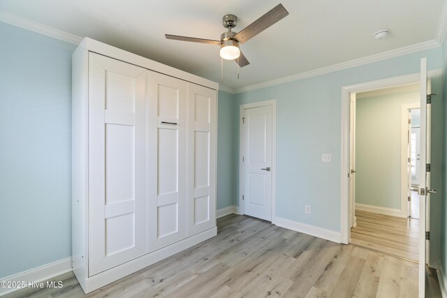 615 N New River Dr Unit E, Surf City, NC 28445 - unfurnished bedroom with baseboards, ornamental molding, and light wood-type flooring
