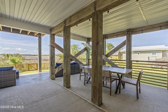 615 N New River Dr Unit E, Surf City, NC 28445 - view of patio featuring a water view and outdoor dining space
