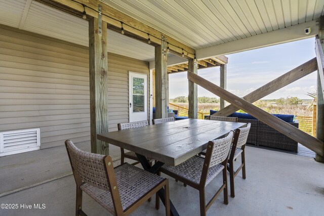 615 N New River Dr Unit E, Surf City, NC 28445 - view of patio / terrace with outdoor dining area