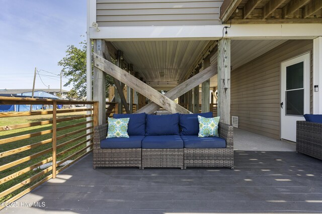 615 N New River Dr Unit E, Surf City, NC 28445 - wooden terrace featuring visible vents and an outdoor living space