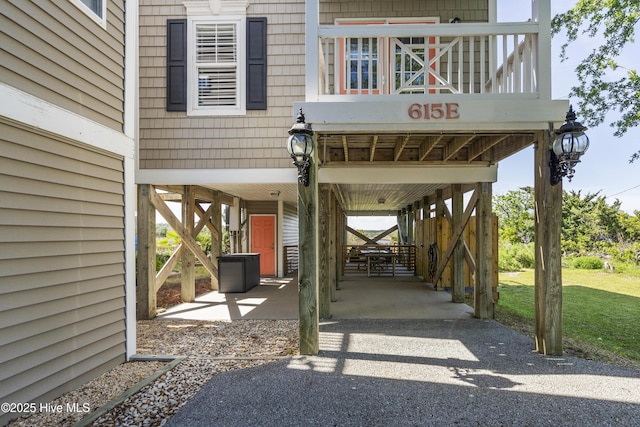 615 N New River Dr Unit E, Surf City, NC 28445 - view of patio / terrace featuring driveway and a carport