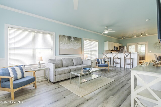 615 N New River Dr Unit E, Surf City, NC 28445 - living room with a ceiling fan, ornamental molding, and light wood-style floors