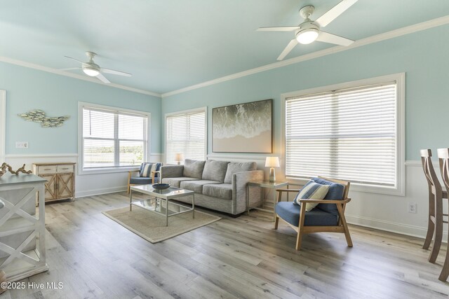 615 N New River Dr Unit E, Surf City, NC 28445 - living room featuring crown molding, light wood-style floors, ceiling fan, and baseboards