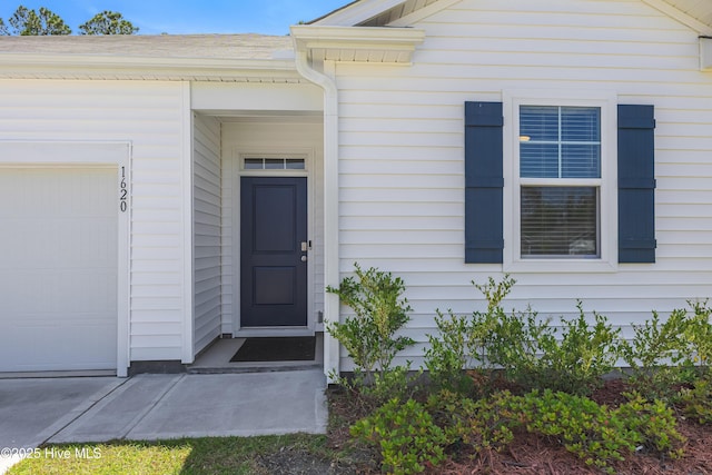 entrance to property with an attached garage