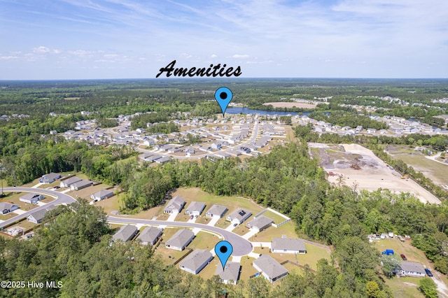 aerial view featuring a residential view and a forest view