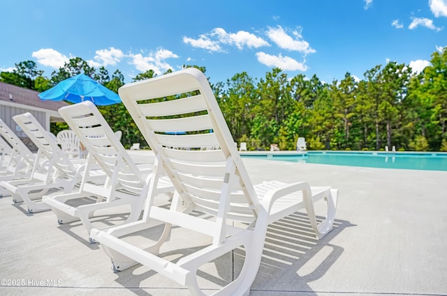 community pool featuring a patio area