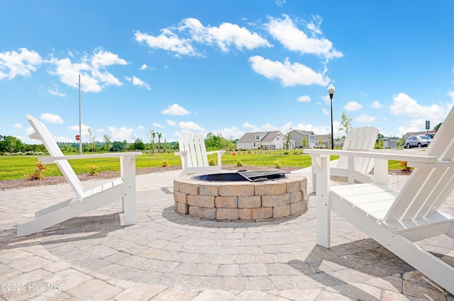 view of patio / terrace featuring a fire pit