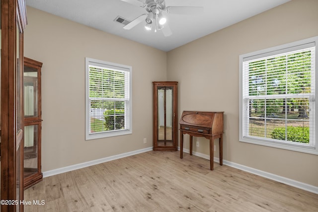 interior space featuring visible vents, baseboards, a wealth of natural light, and light wood-type flooring