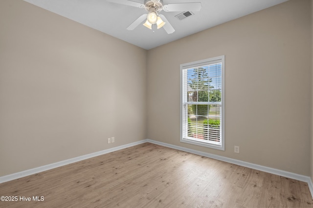 unfurnished room with visible vents, baseboards, ceiling fan, and light wood-style floors