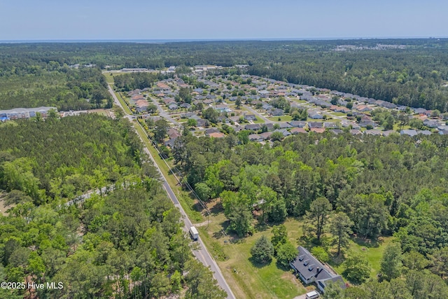 bird's eye view featuring a forest view