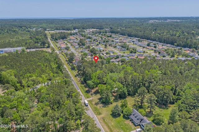 aerial view featuring a view of trees