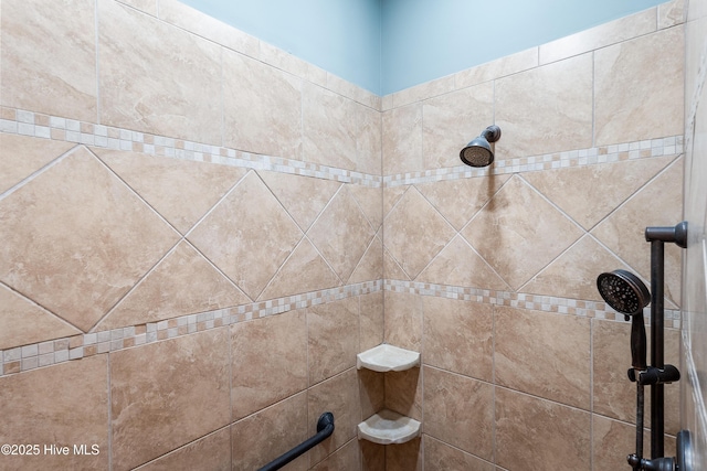 bathroom view of tiled shower